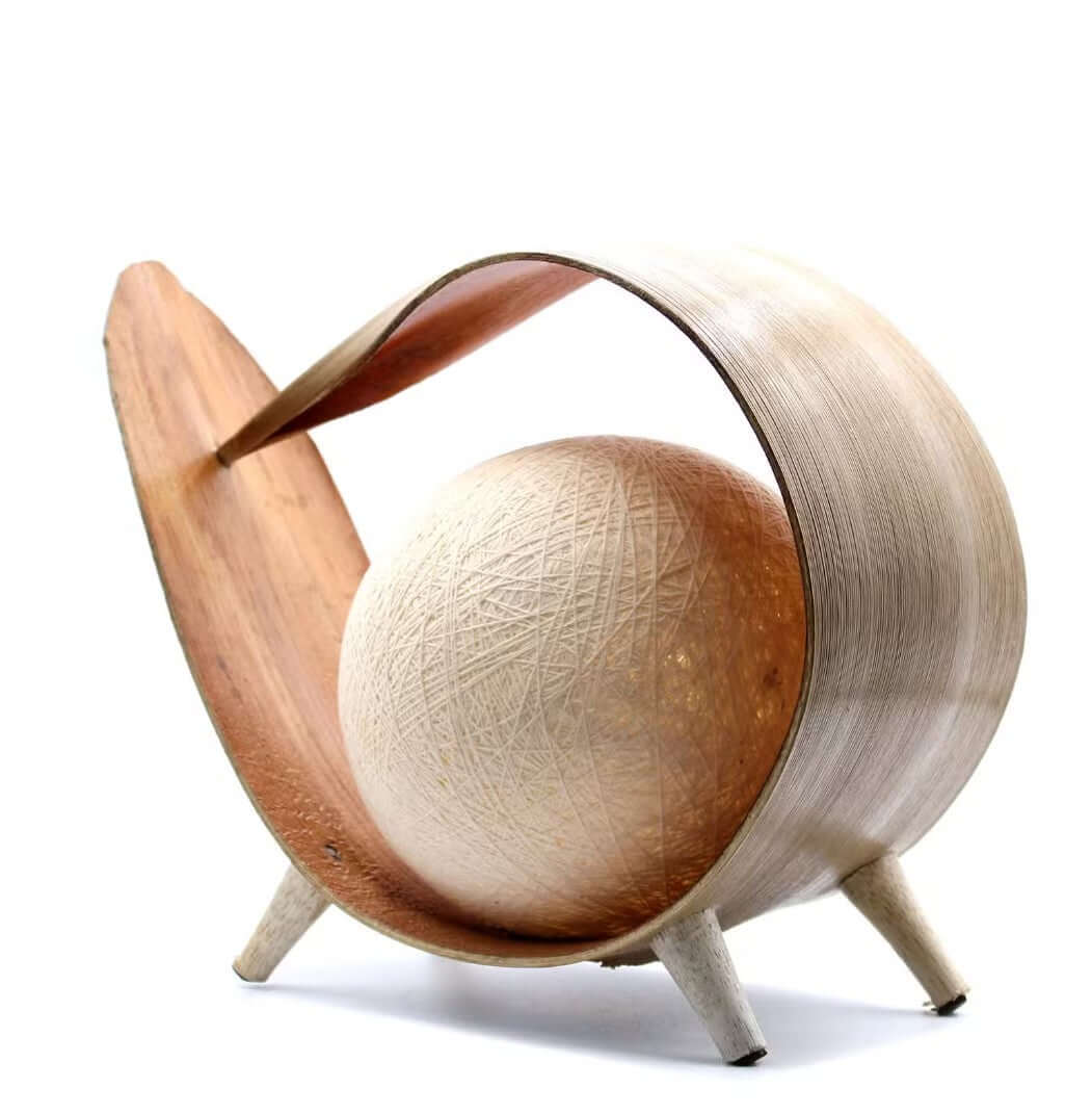 A natural coconut lamp on a white background