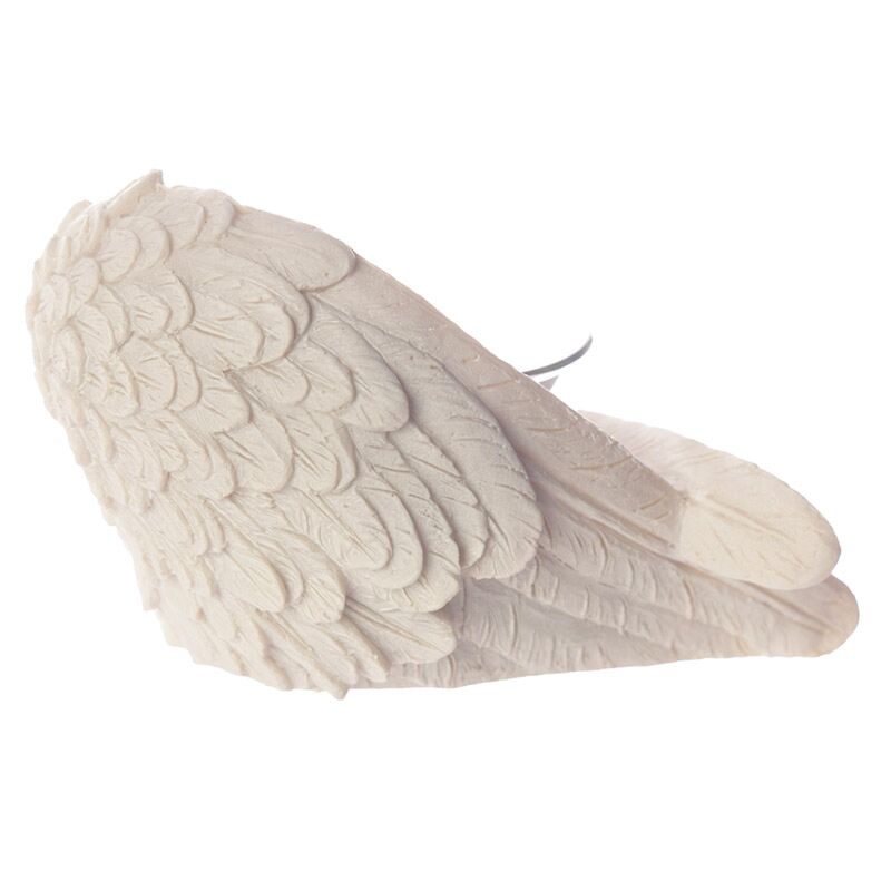 White angel wing sculpture on a white background