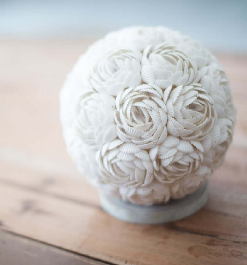 White textured  lamp on a wooden surface