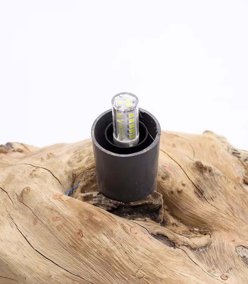 driftwood glow lamp with a gamal wood base featuring a modern light bulb design.