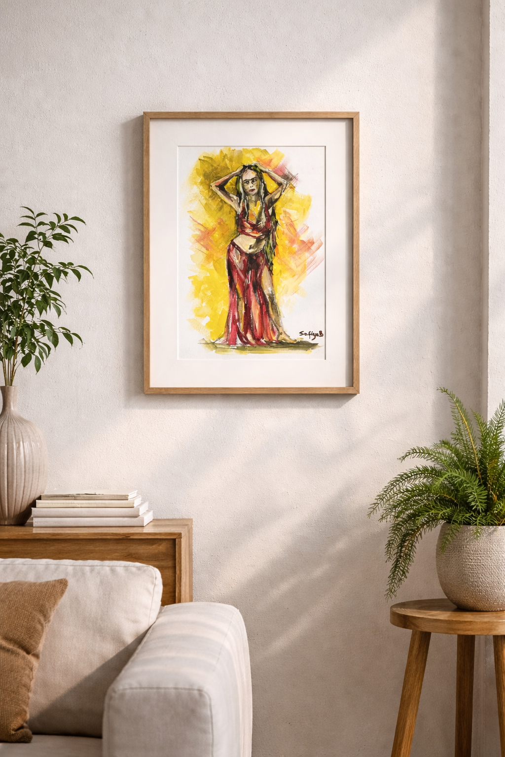 Framed artwork of a woman in a red dress on a wall in a living room.