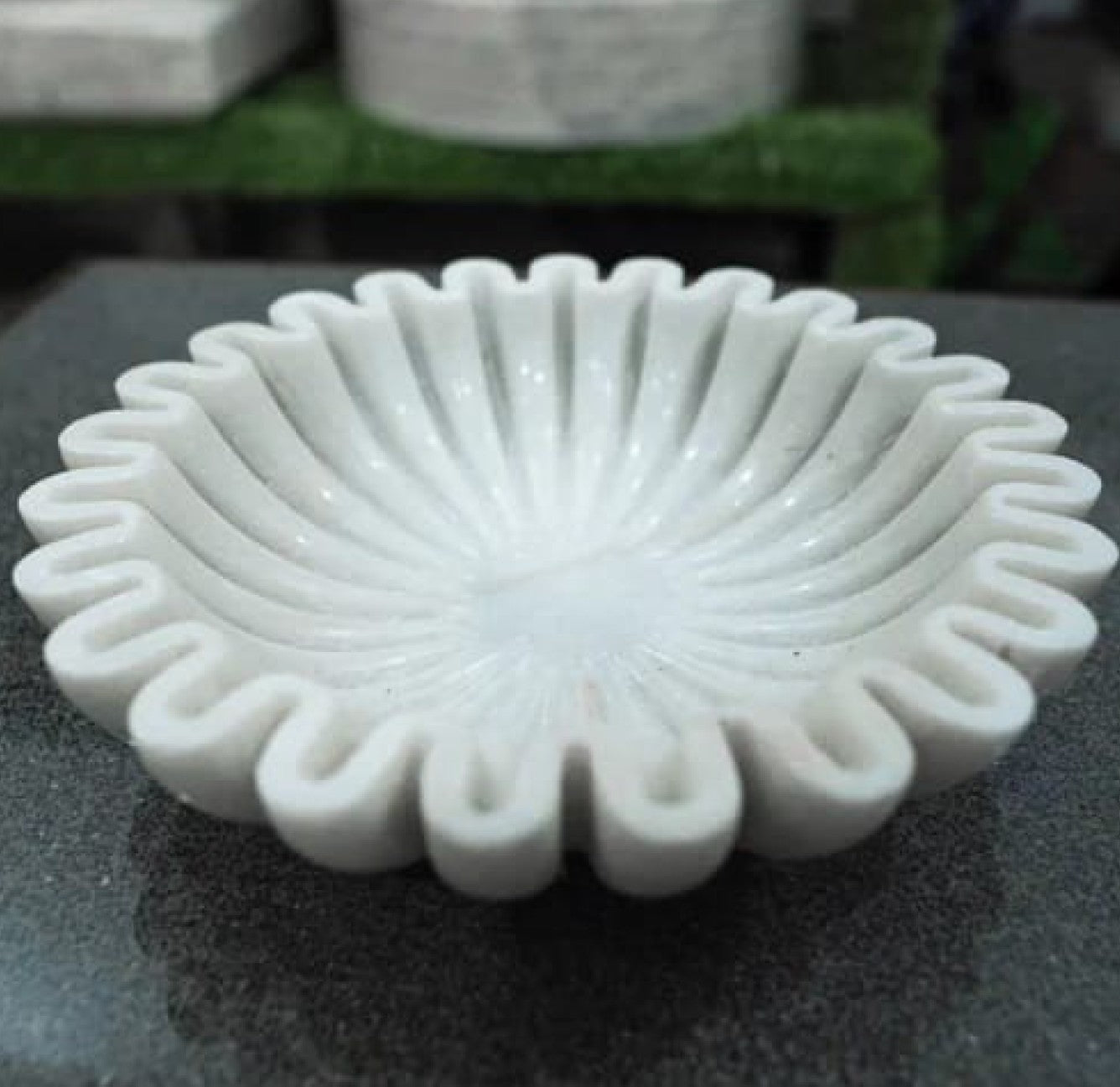 Sculpted marble statement bowl showcasing elegant lines and natural texture in a 70 cm handcrafted design.