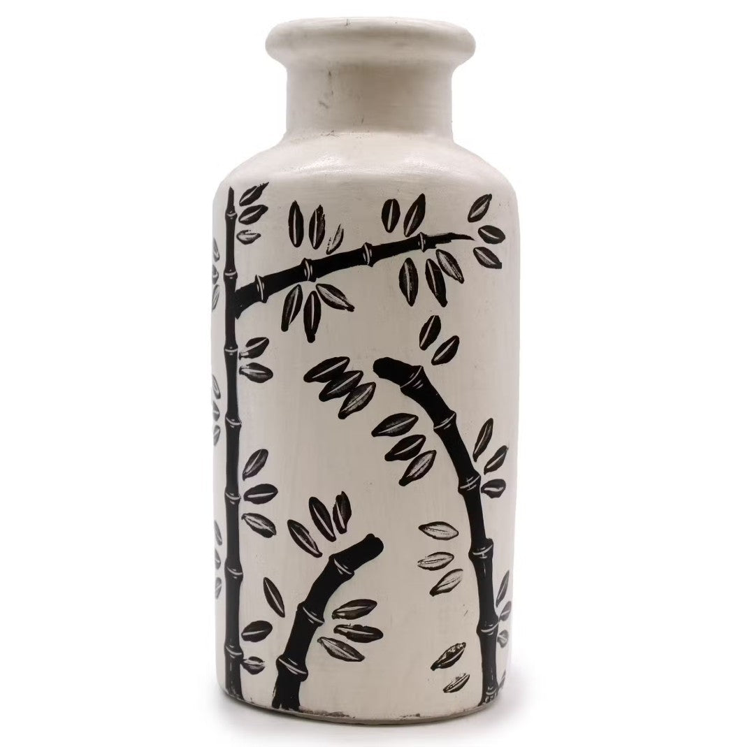 White ceramic vase with black bamboo branch design on a white background
